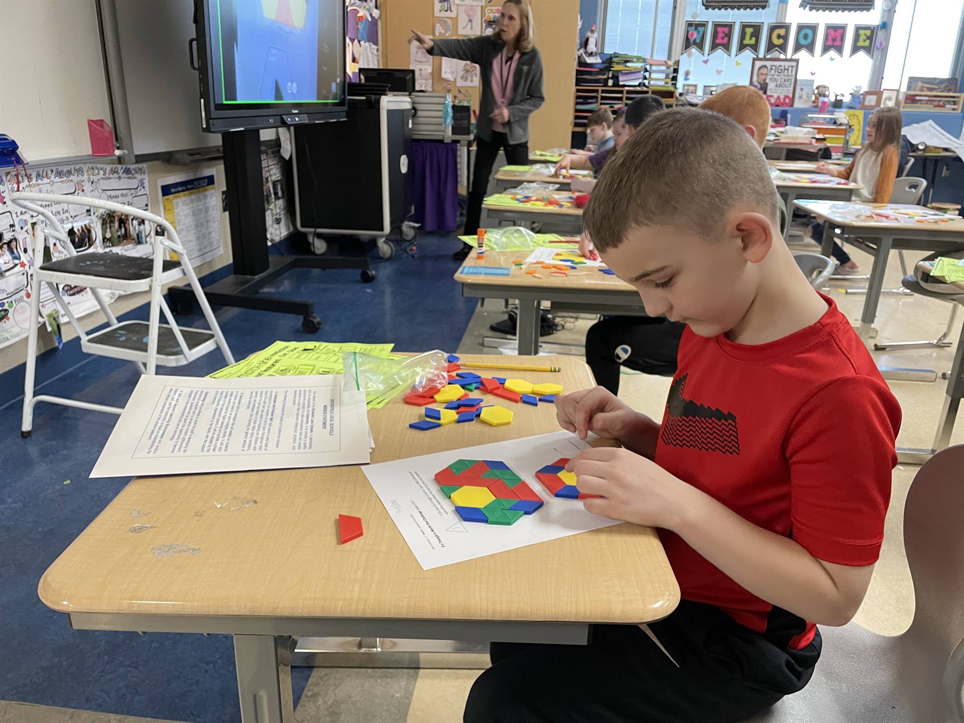 Students use blocks to create 2D shapes