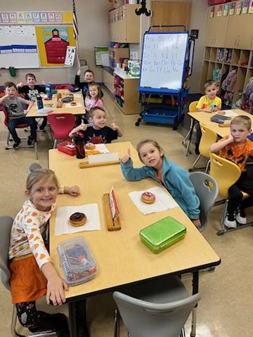 Mrs. Flanagan&#39;s class enjoys donuts for raising the most money!